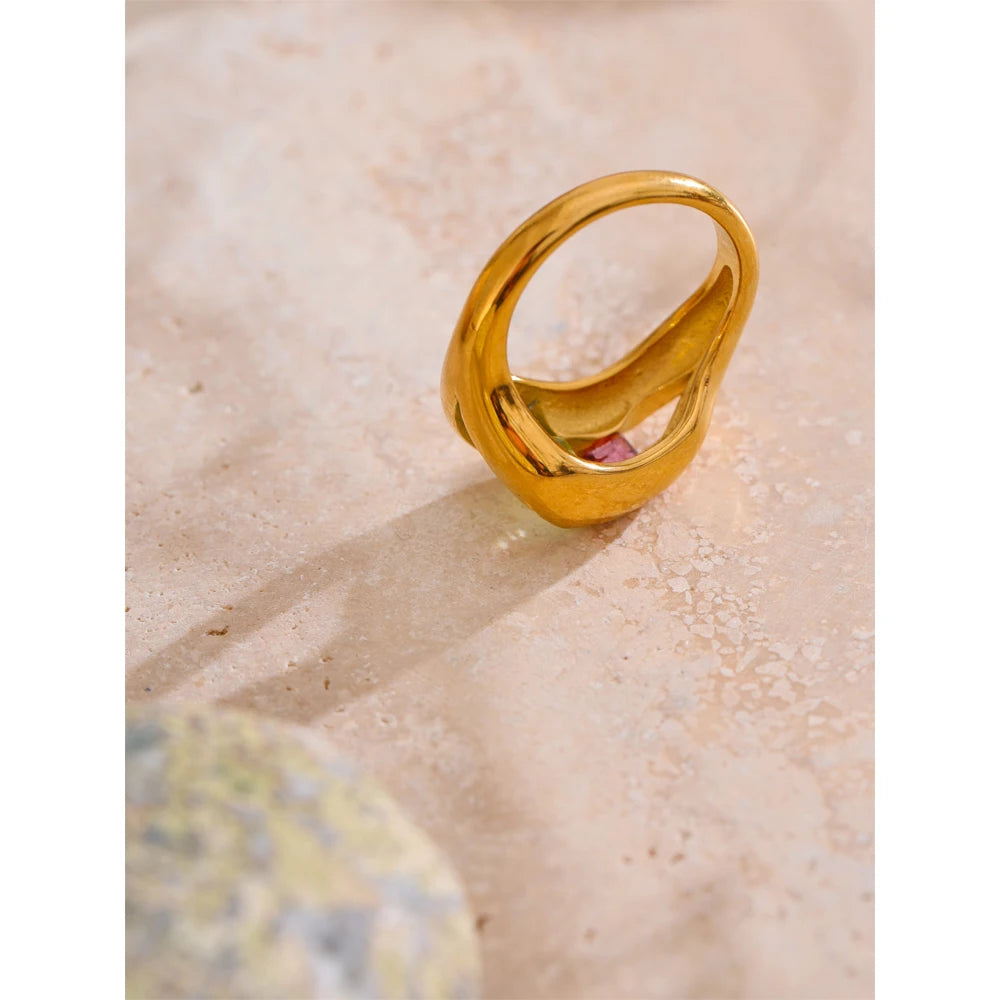 Cubic zirconia geometric ring in 18K gold-plated stainless steel with cubic zirconia.