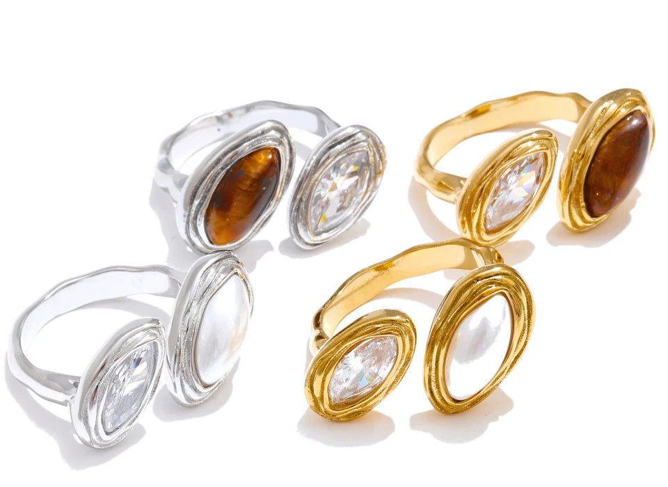 Cubic zirconia geometric ring in 18K gold-plated stainless steel with cubic zirconia.