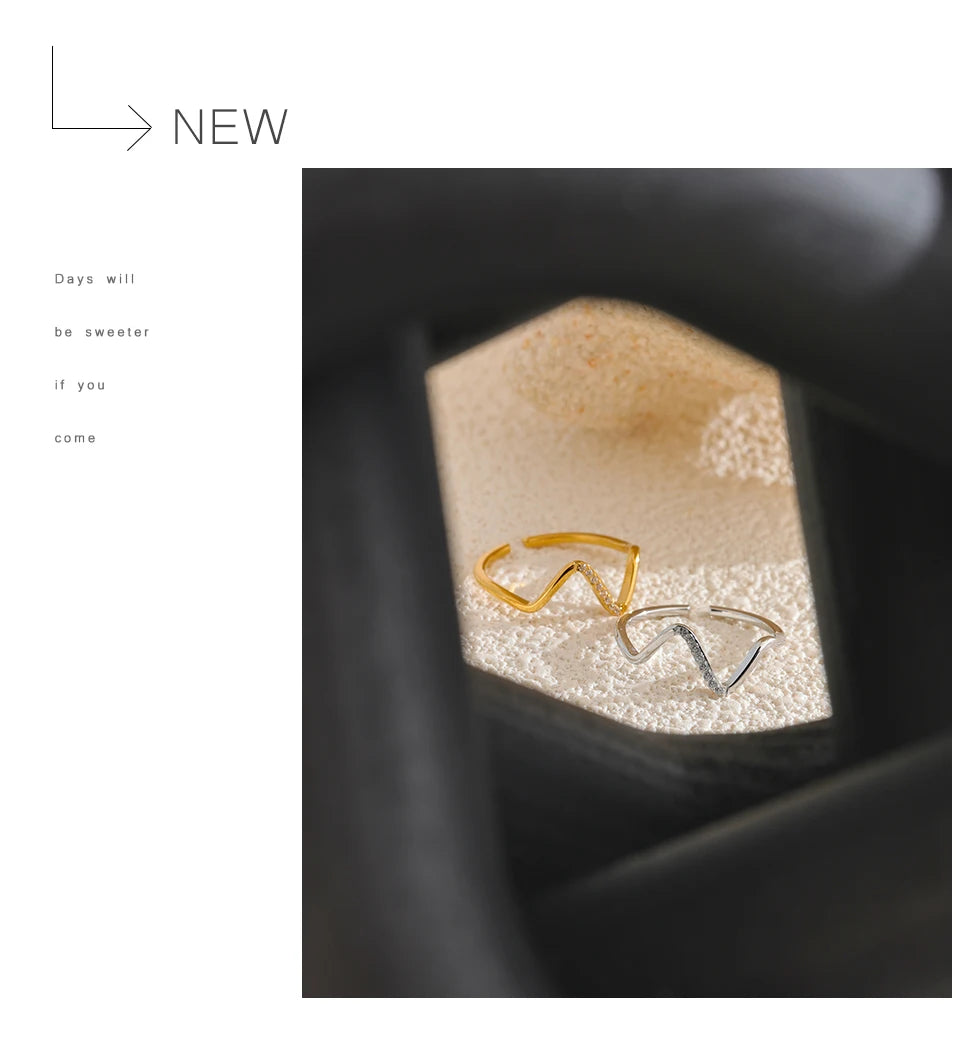 Cubic zirconia geometric ring in 18K gold-plated stainless steel with cubic zirconia.