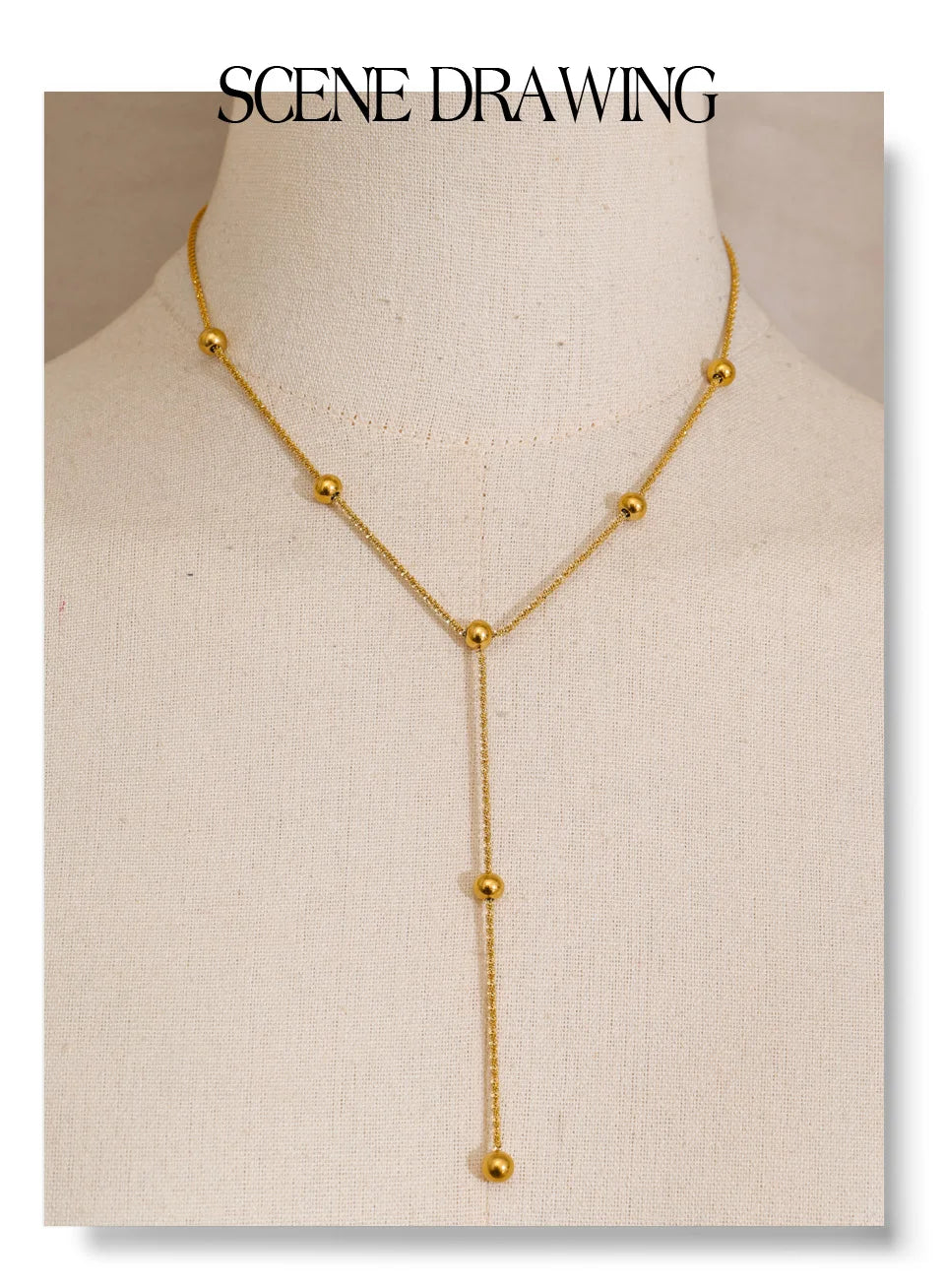 Beaded geometric chain necklace in gold-plated stainless steel.