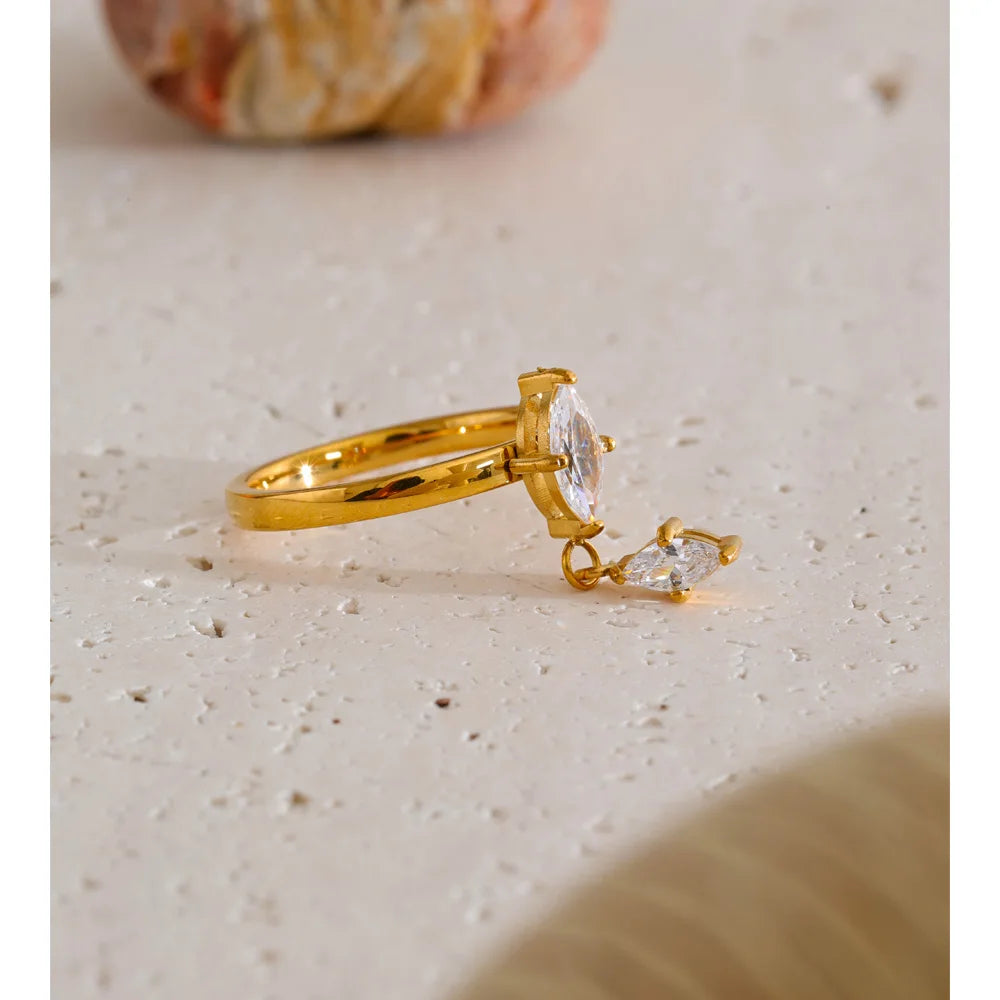 Cubic zirconia geometric ring in 18K gold-plated stainless steel with cubic zirconia.
