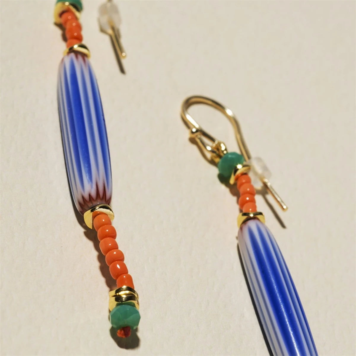 Stainless steel fashionable small fish plated with 18k gold, niche ins style earrings with color retention