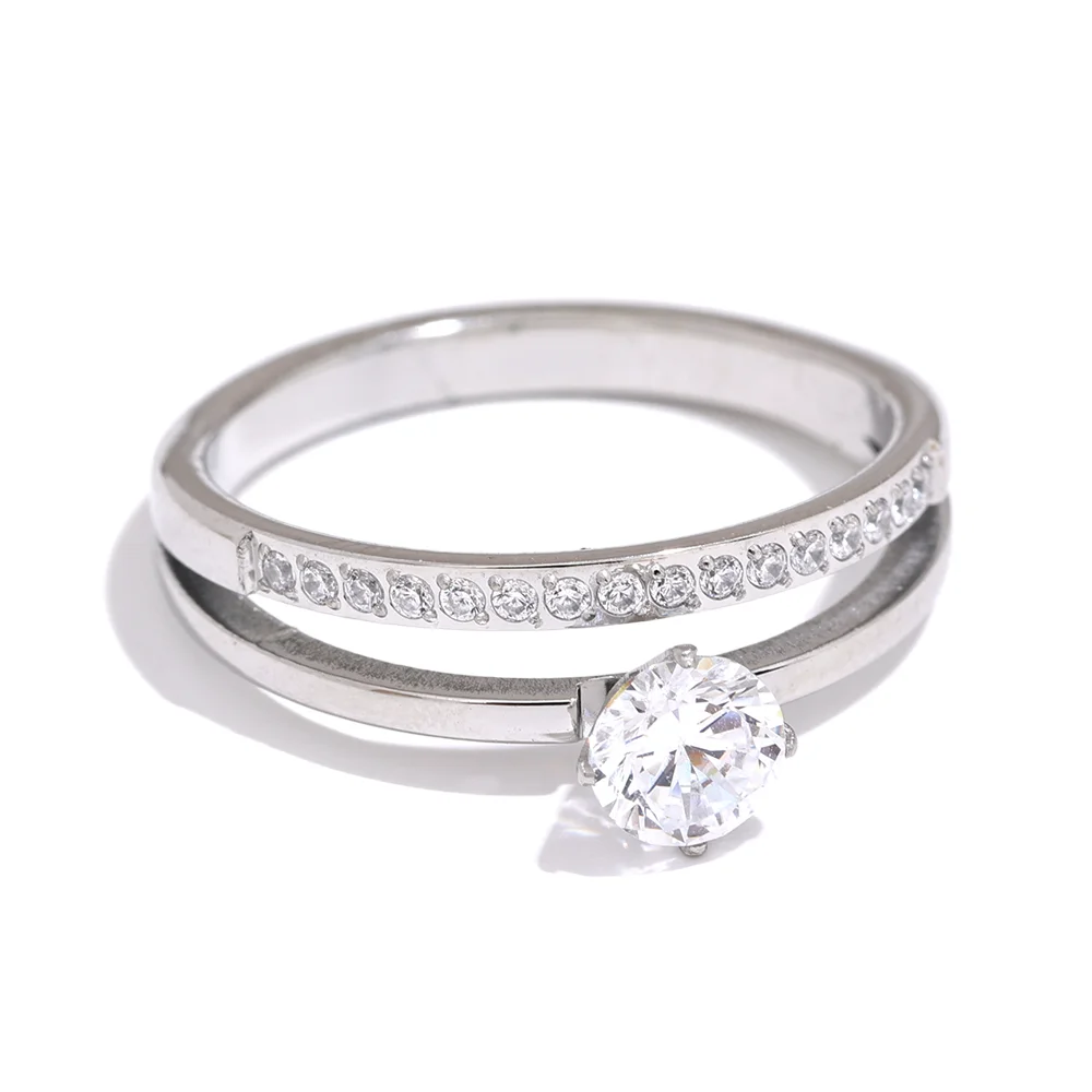 Cubic zirconia geometric layered ring in gold-plated stainless steel with cubic zirconia.