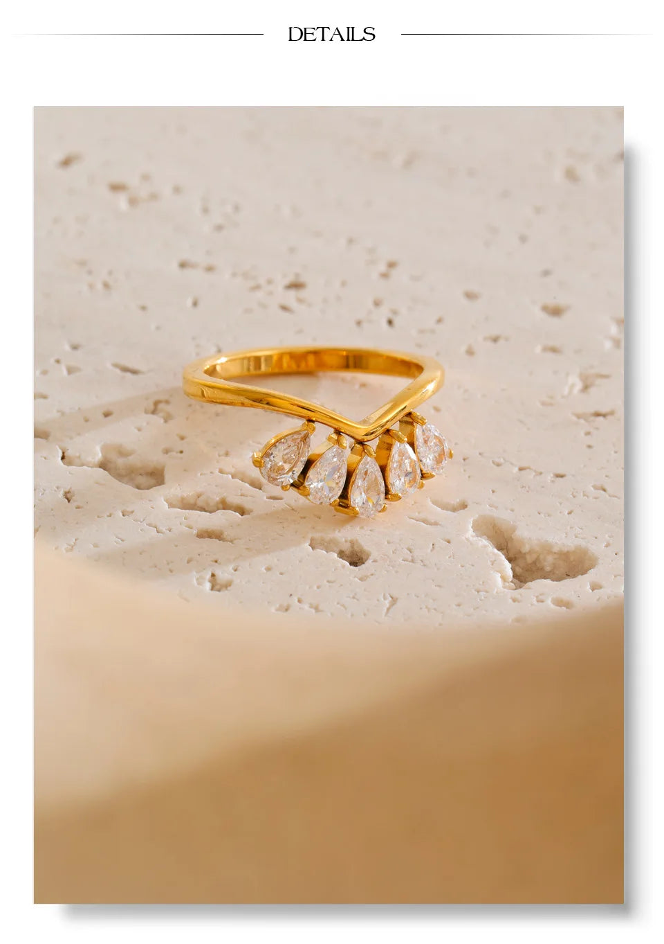Cubic zirconia flower geometric ring in 18K gold-plated stainless steel with cubic zirconia.