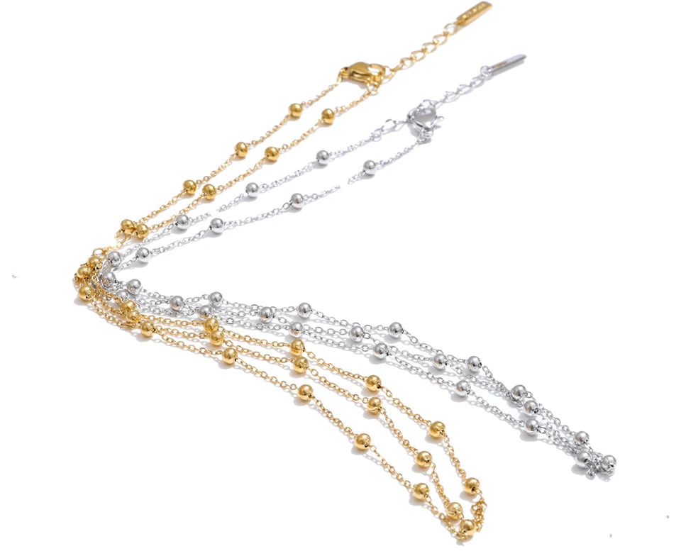 Beaded geometric chain necklace in gold-plated stainless steel.