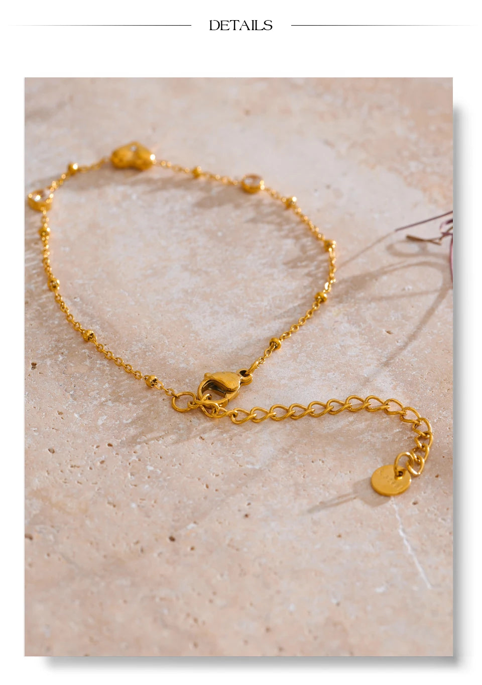 Cubic zirconia heart chain necklace in gold-plated stainless steel with cubic zirconia.