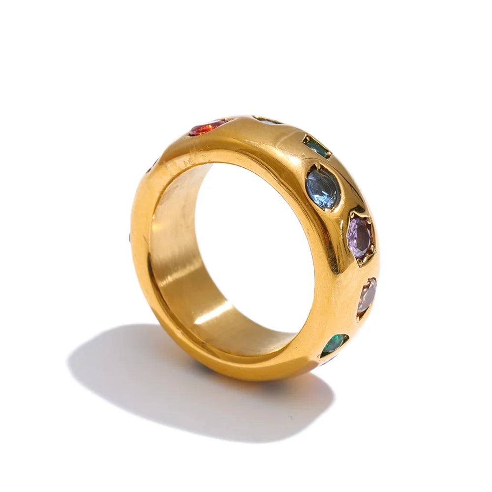 Cubic zirconia multi-color geometric ring in 18K gold-plated stainless steel with cubic zirconia.