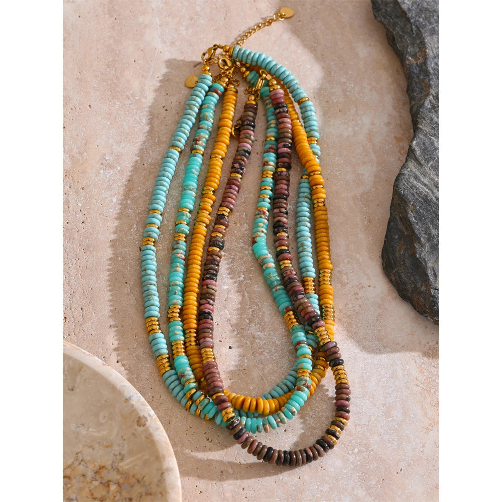 Natural stone beaded multi-color necklace in gold-plated stainless steel with natural stone.