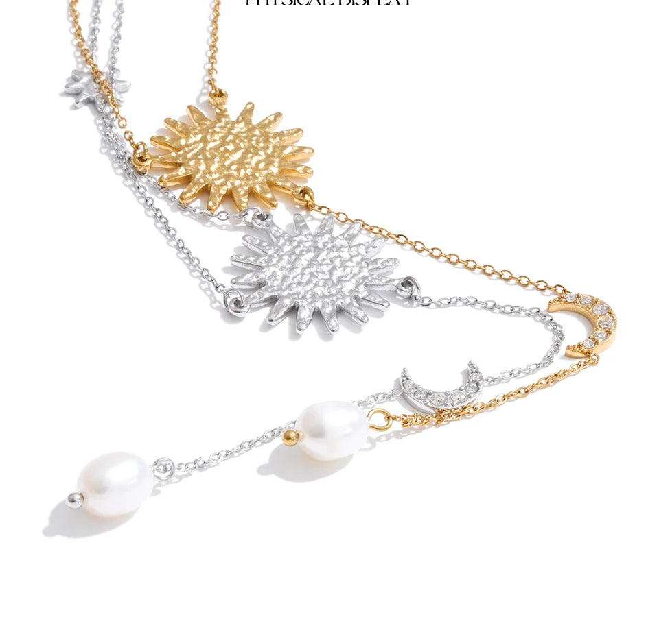 Cubic zirconia freshwater pearl heart necklace in gold-plated stainless steel with freshwater pearl and cubic zirconia.