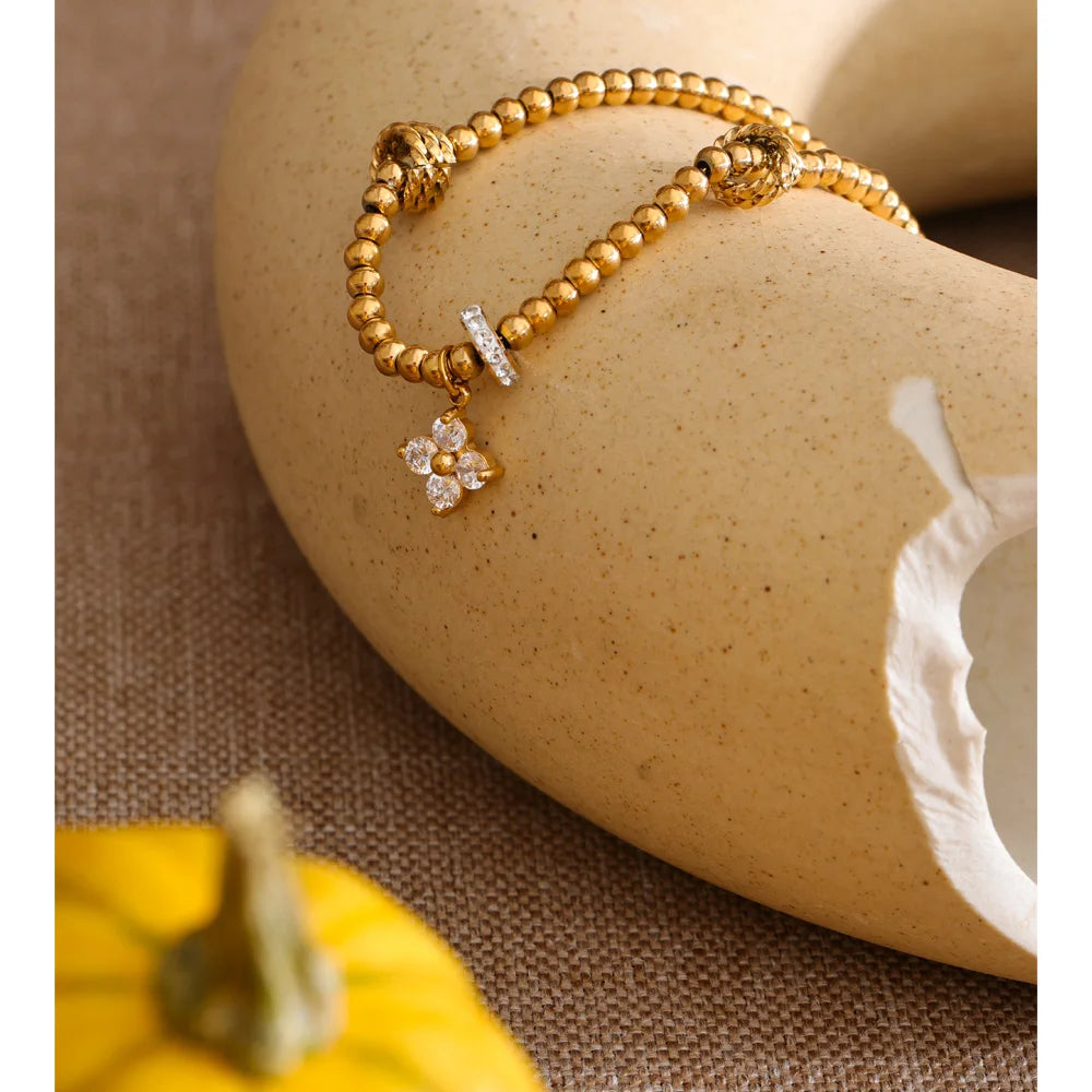 Cubic Zirconia Flower Beaded Bracelet — Gold-Plated Stainless Steel with Cubic Zirconia · PS1066