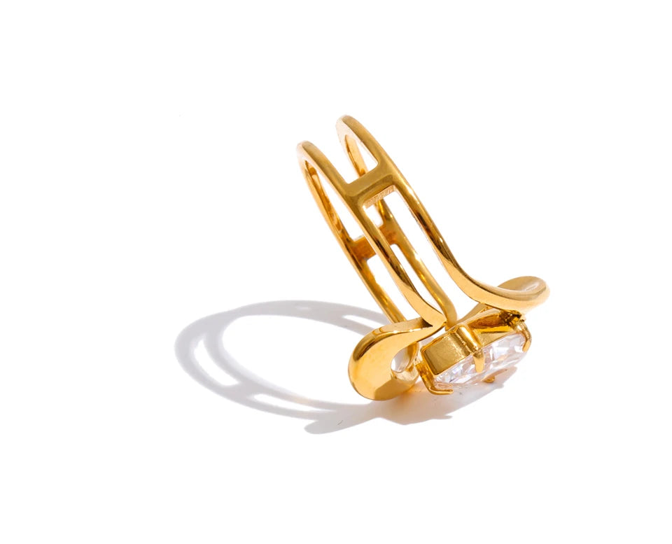 Cubic zirconia geometric ring in 18K gold-plated stainless steel with cubic zirconia.