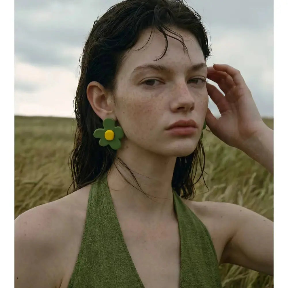 Green resin acrylic earrings in gold-plated stainless steel with resin and acrylic.
