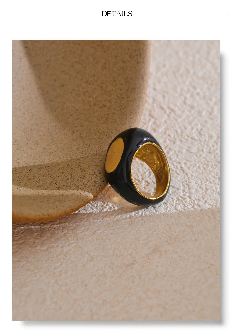Black enamel geometric ring in gold-plated 316L stainless steel with enamel.