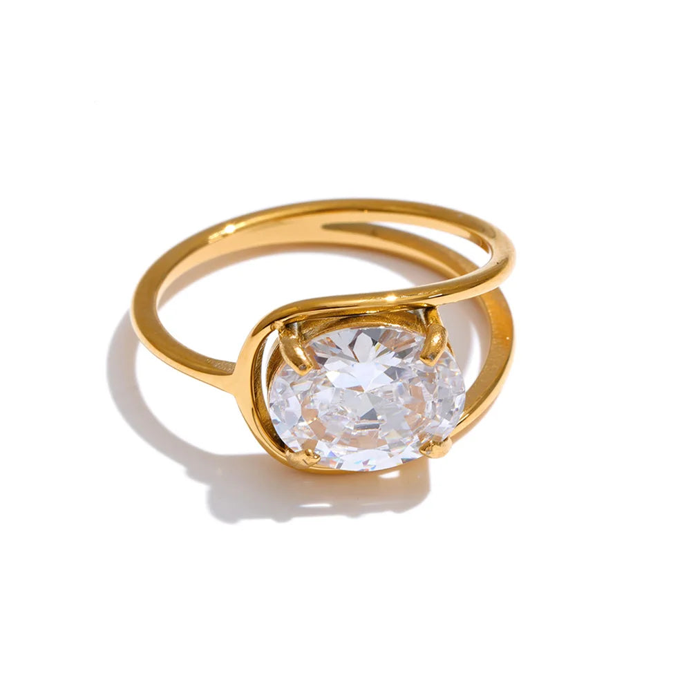 Cubic zirconia geometric ring in 18K gold-plated stainless steel with cubic zirconia.