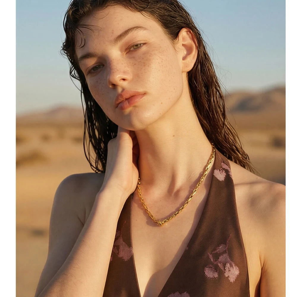 Geometric chain necklace in gold-plated stainless steel.