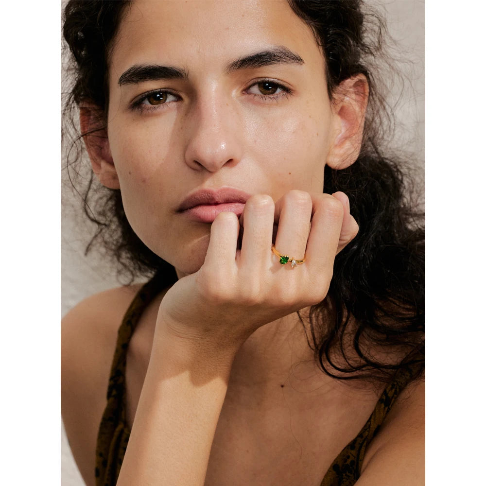 Cubic zirconia geometric ring in 18K gold-plated stainless steel with cubic zirconia.
