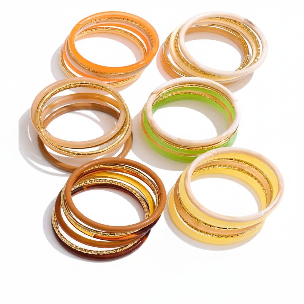 Gold-plated stainless steel bracelet with resin bands in various colors.