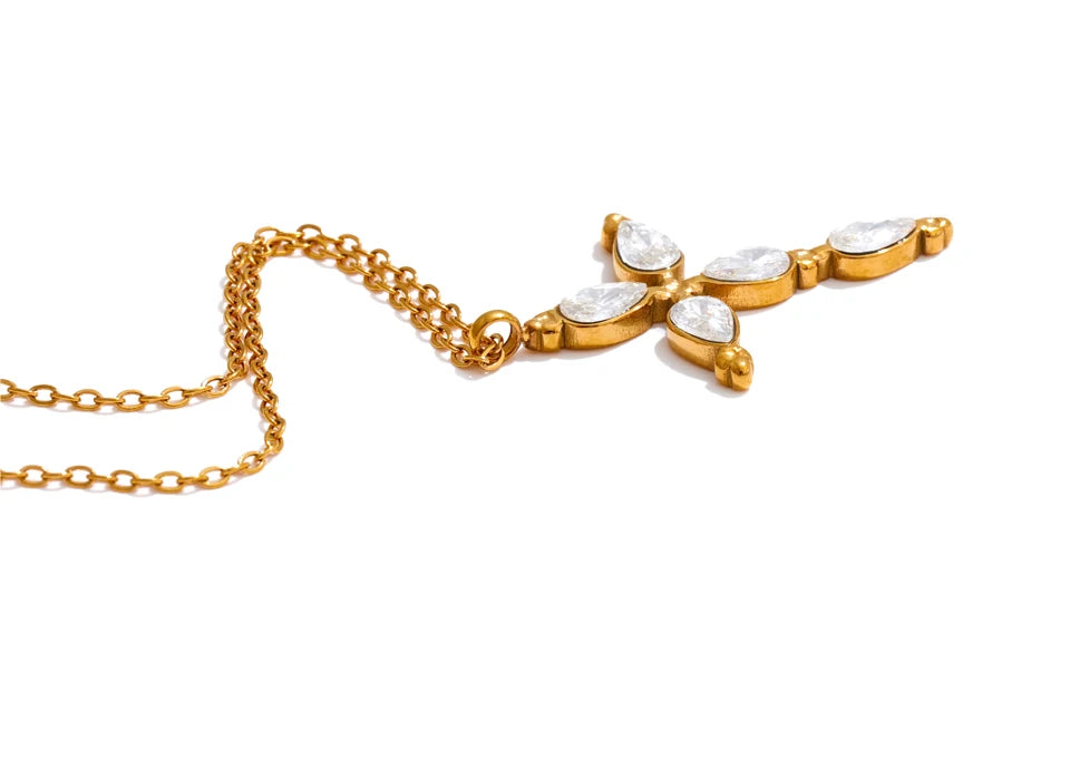 Cubic zirconia cross necklace in gold-plated stainless steel with cubic zirconia.