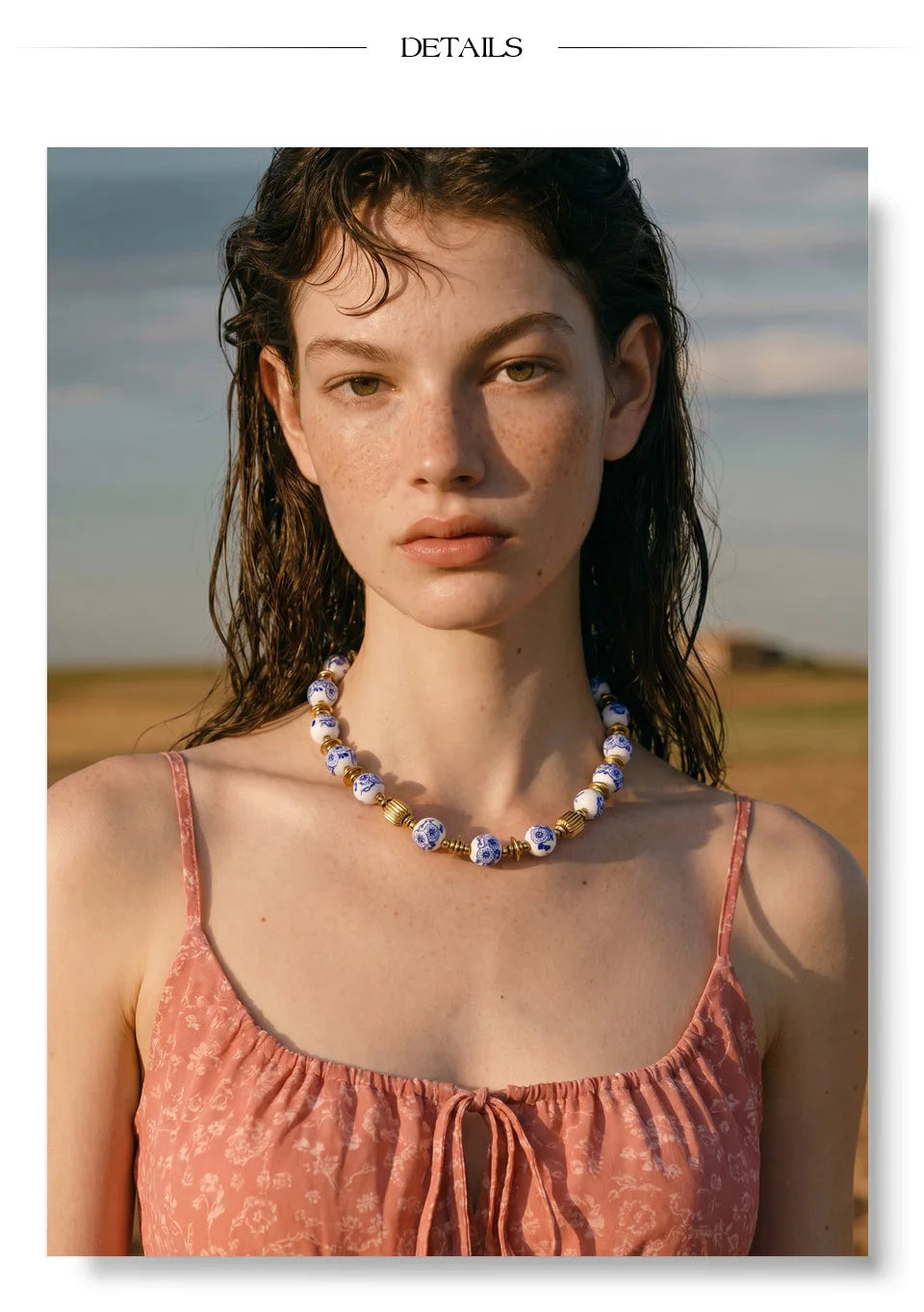 Blue flower beaded necklace in gold-plated stainless steel.