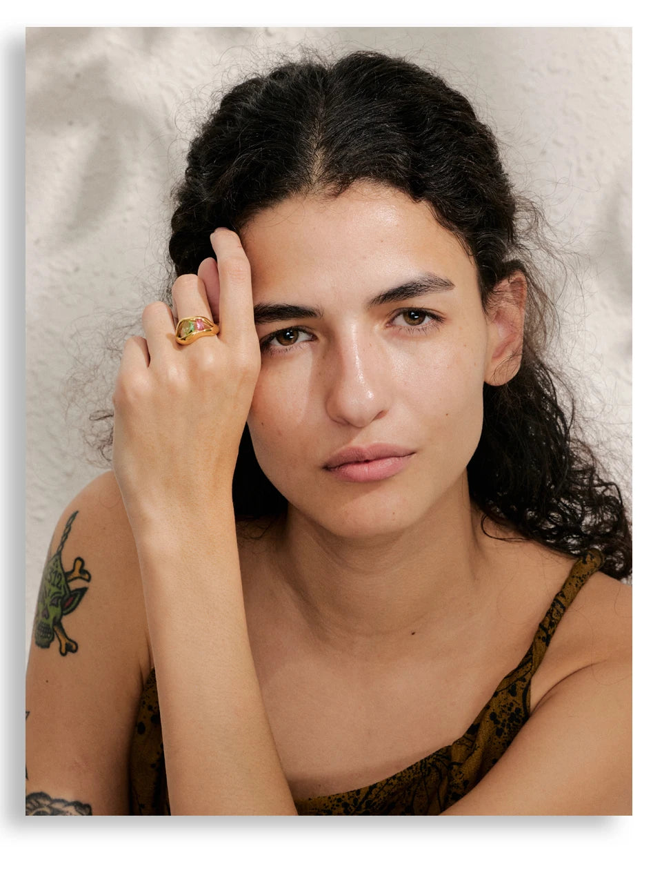 Cubic zirconia geometric ring in 18K gold-plated stainless steel with cubic zirconia.