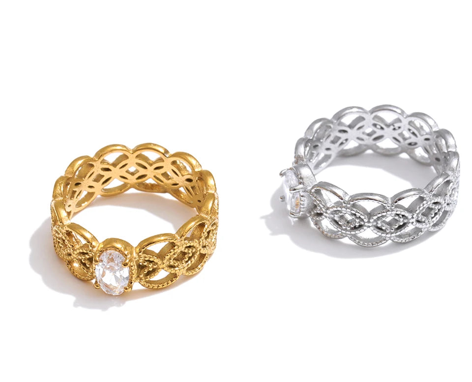 Cubic zirconia geometric ring in 18K gold-plated stainless steel with cubic zirconia.
