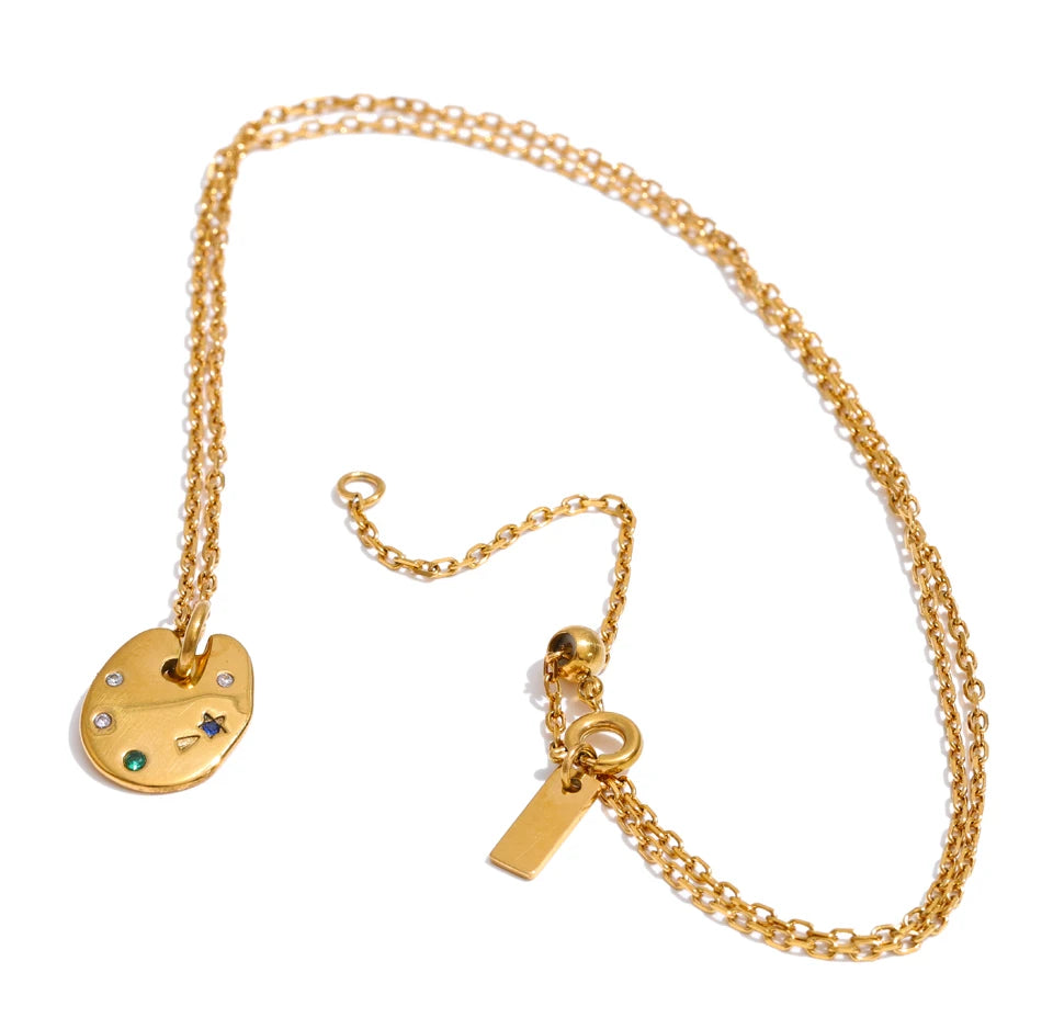 Cubic zirconia multi-color geometric necklace in gold-plated stainless steel with cubic zirconia.