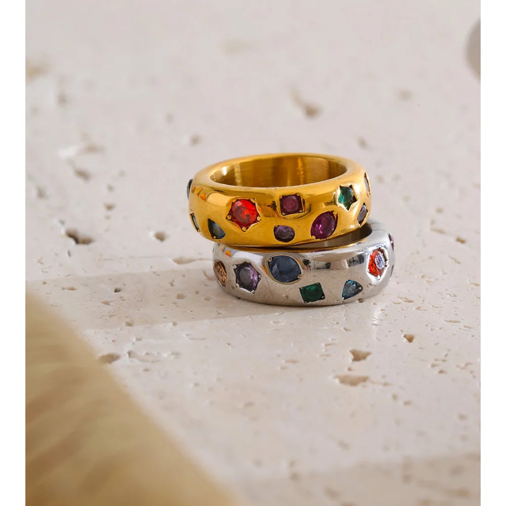 Cubic zirconia multi-color geometric ring in 18K gold-plated stainless steel with cubic zirconia.