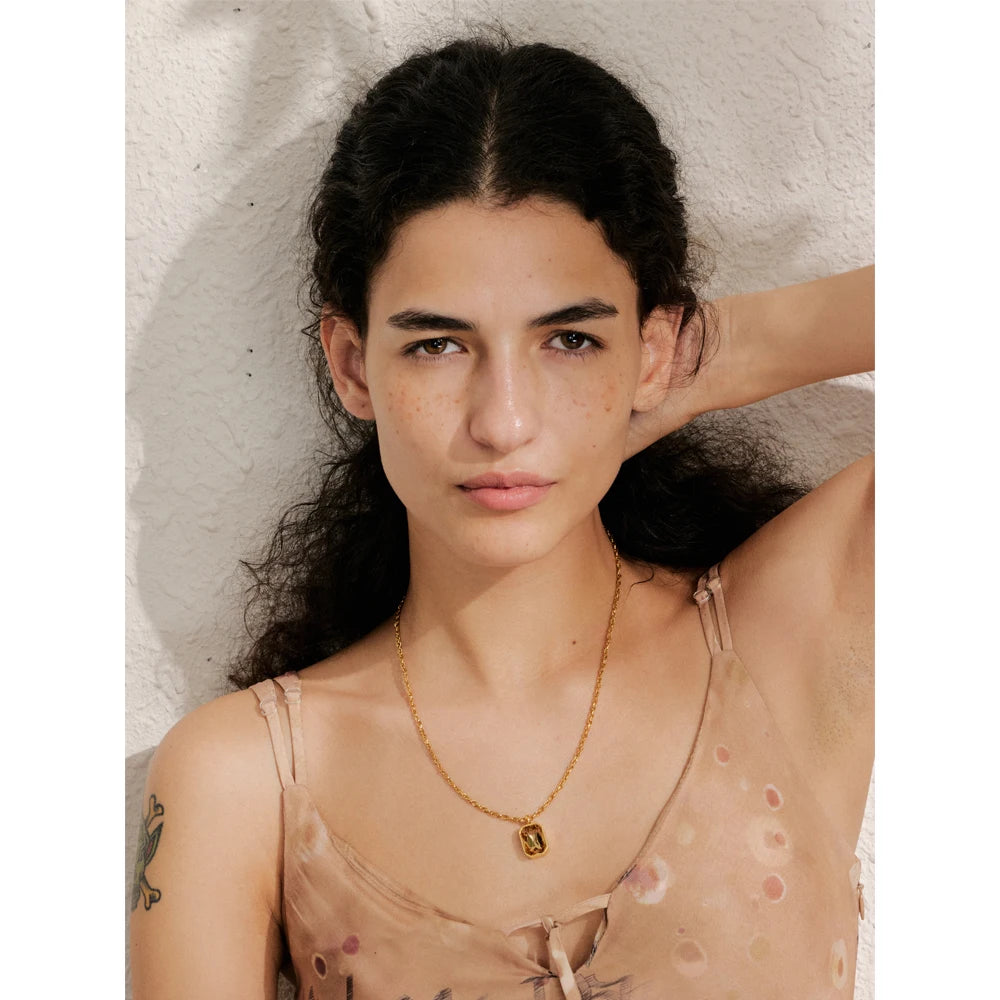 Cubic zirconia geometric necklace in gold-plated stainless steel with cubic zirconia.