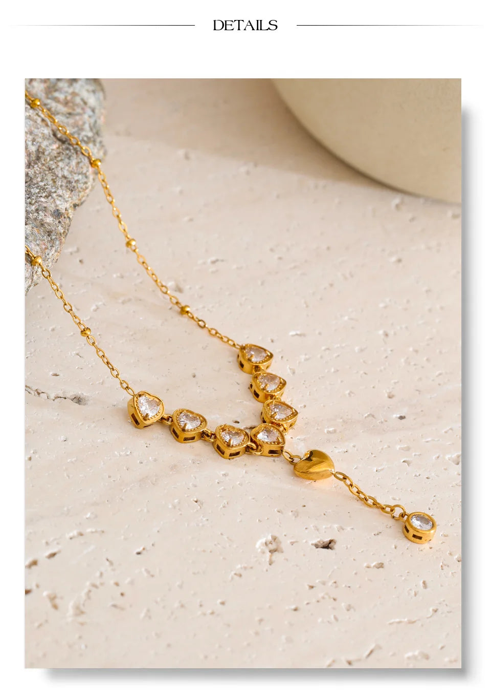 Cubic zirconia heart necklace in gold-plated stainless steel with cubic zirconia.