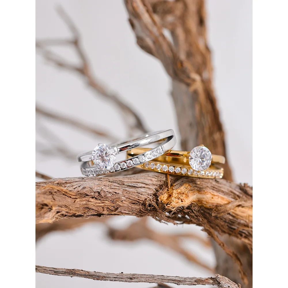 Cubic zirconia geometric layered ring in gold-plated stainless steel with cubic zirconia.