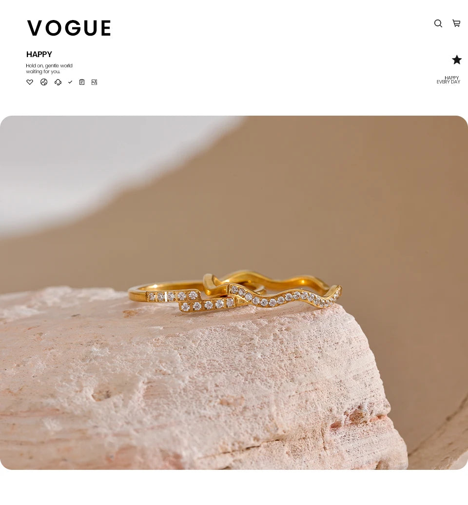 Cubic zirconia geometric ring in 18K gold-plated stainless steel with cubic zirconia.