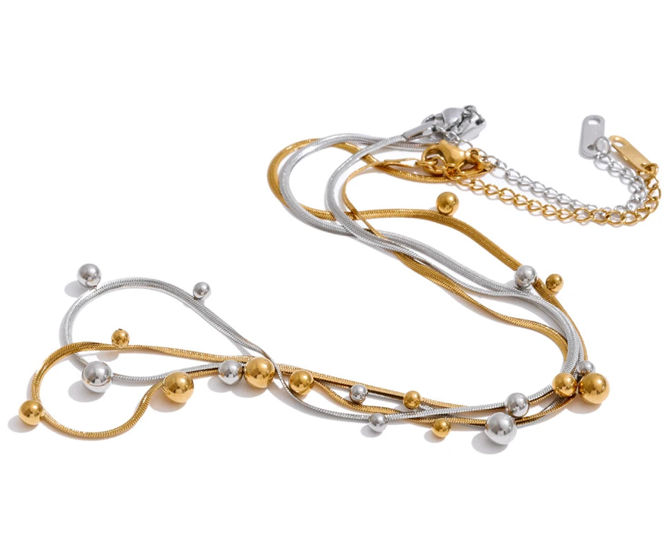 Beaded geometric chain necklace in gold-plated stainless steel.