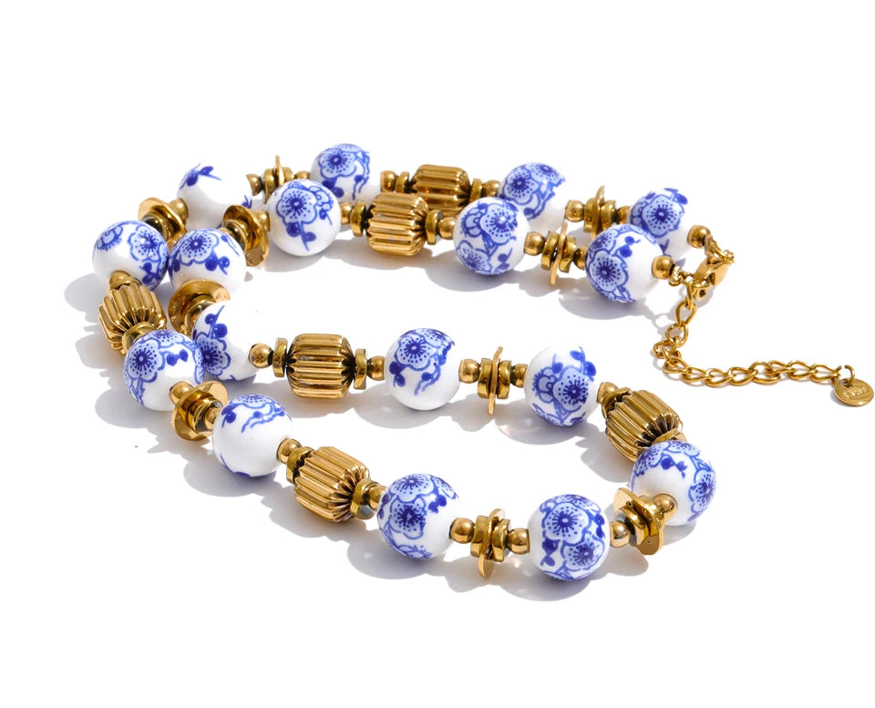 Blue flower beaded necklace in gold-plated stainless steel.