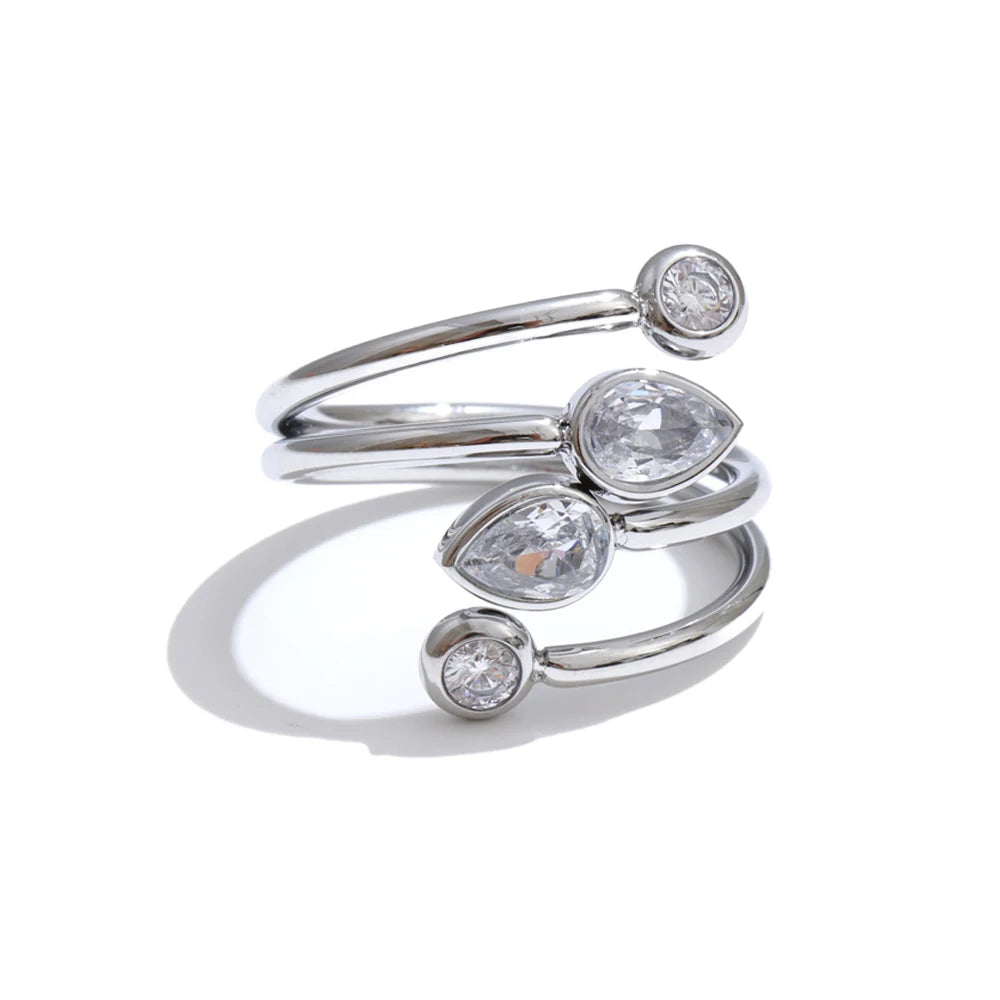 Cubic zirconia geometric layered ring in 18K gold-plated stainless steel with cubic zirconia.