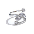 Cubic zirconia geometric layered ring in 18K gold-plated stainless steel with cubic zirconia.