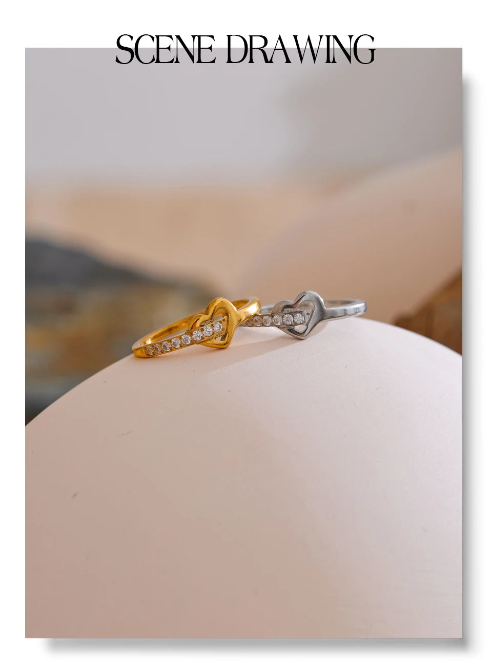 Cubic zirconia heart cross ring in 18K gold-plated stainless steel with cubic zirconia.
