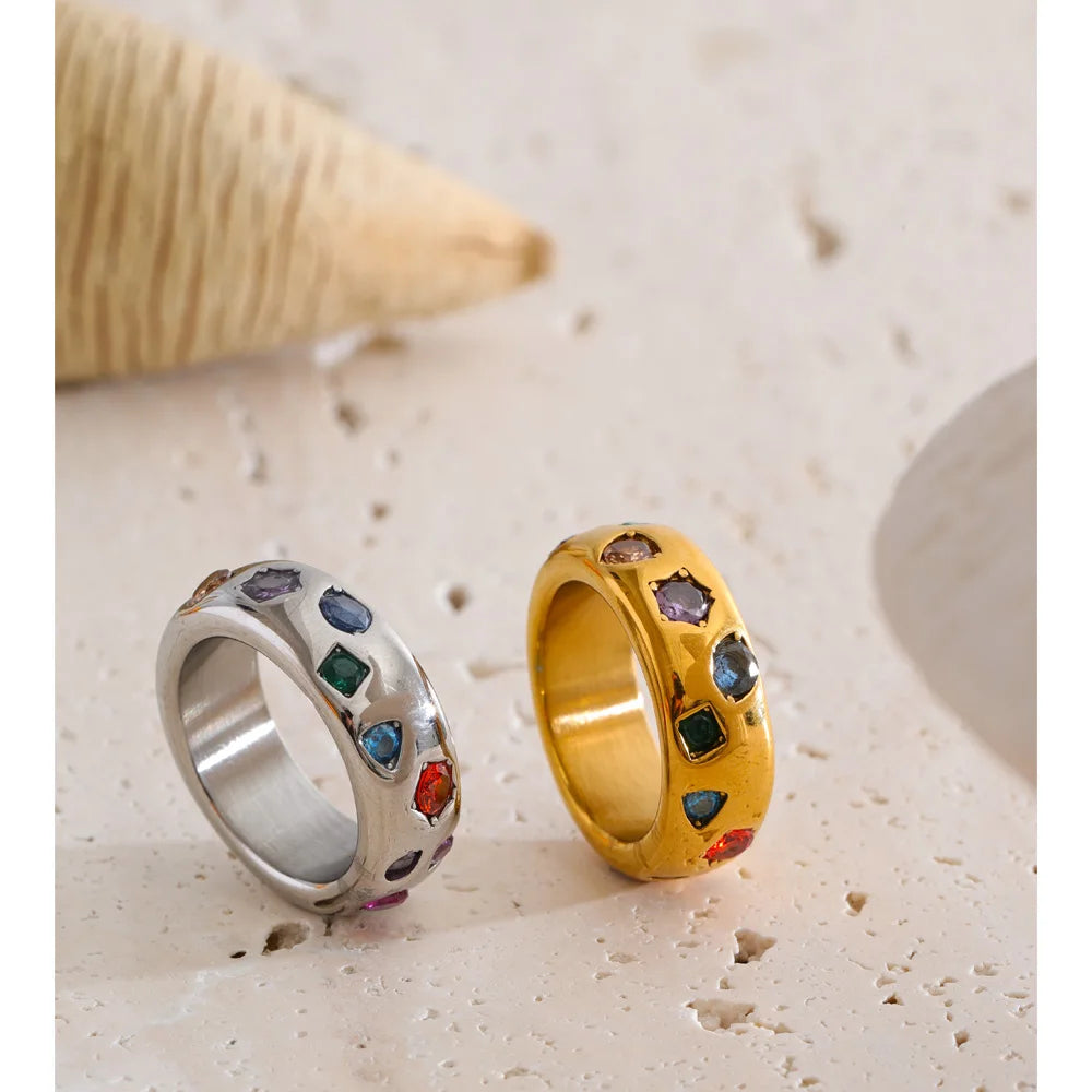 Cubic zirconia multi-color geometric ring in 18K gold-plated stainless steel with cubic zirconia.