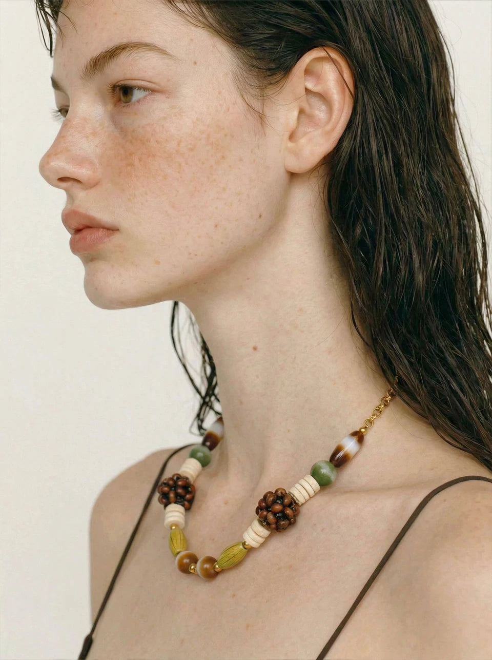 Beaded geometric chain necklace in gold-plated stainless steel.