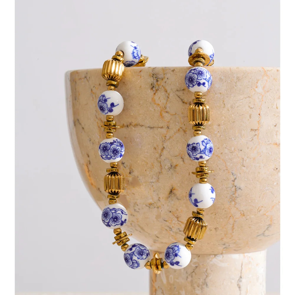 Blue flower beaded necklace in gold-plated stainless steel.