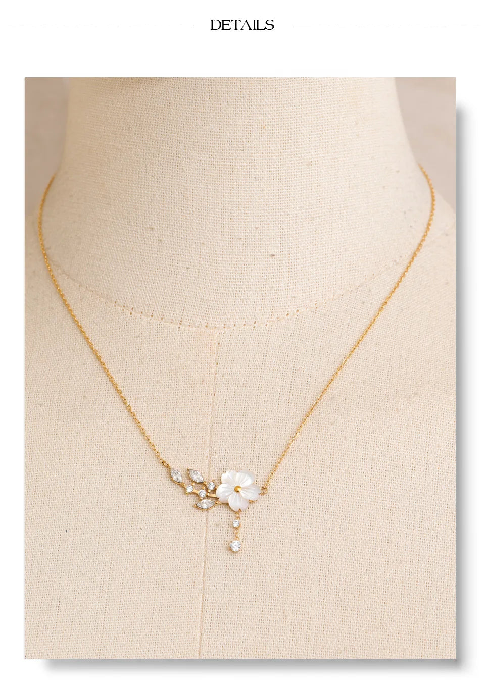 Cubic zirconia shell flower necklace in gold-plated stainless steel with cubic zirconia and shell.
