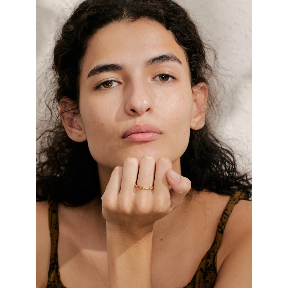 Cubic zirconia geometric ring in gold-plated stainless steel with cubic zirconia.