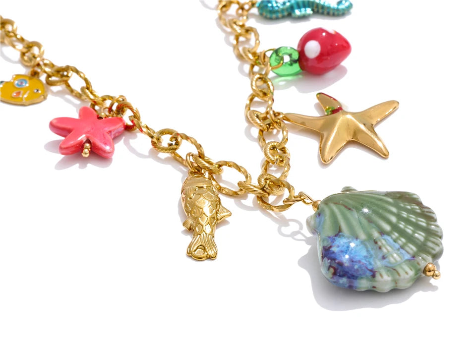 Shell enamel star necklace in gold-plated stainless steel with shell and enamel.