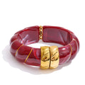 Resin acrylic multi-color bracelet in gold-plated stainless steel with resin and acrylic.