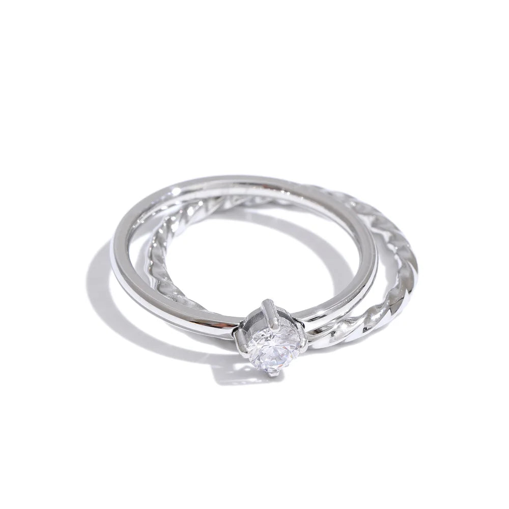 Cubic zirconia geometric ring in gold-plated stainless steel with cubic zirconia.
