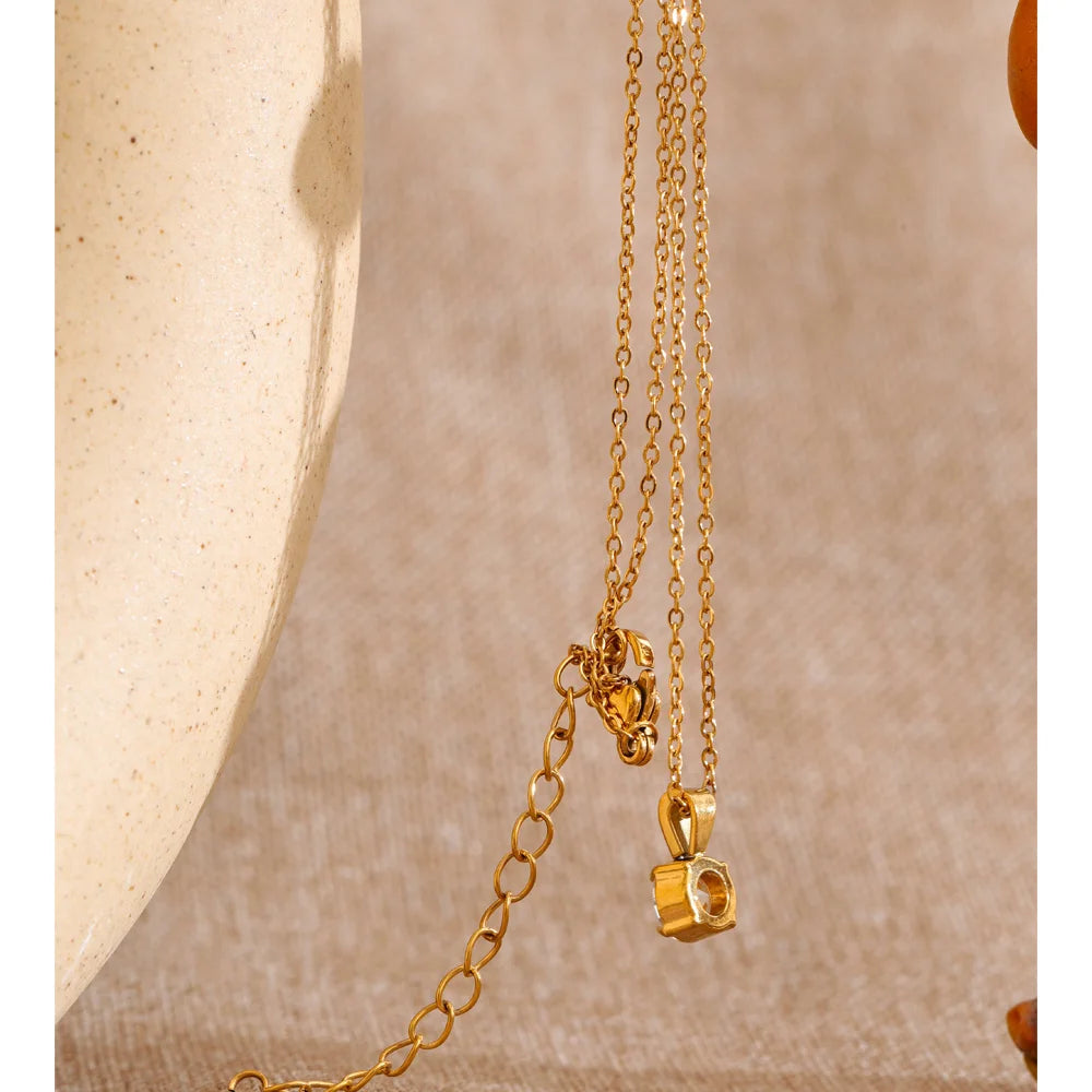 Cubic zirconia geometric necklace in gold-plated stainless steel with cubic zirconia.