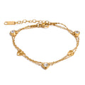Cubic zirconia heart chain necklace in gold-plated stainless steel with cubic zirconia.