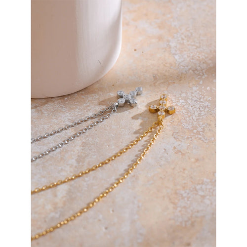 Cubic zirconia cross geometric necklace in gold-plated stainless steel with cubic zirconia.