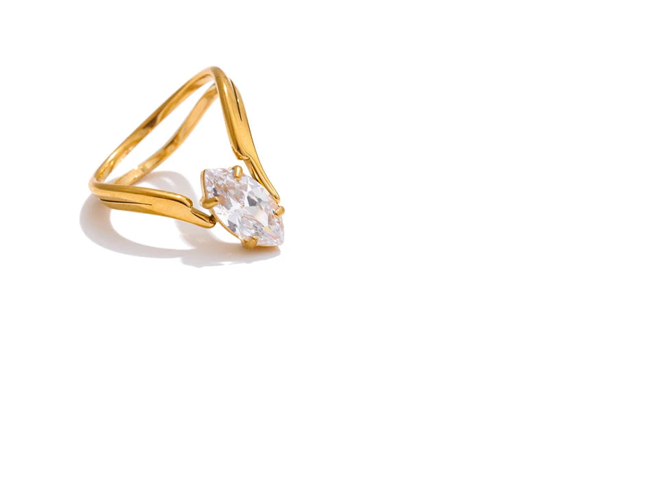 Cubic zirconia geometric ring in 18K gold-plated stainless steel with cubic zirconia.