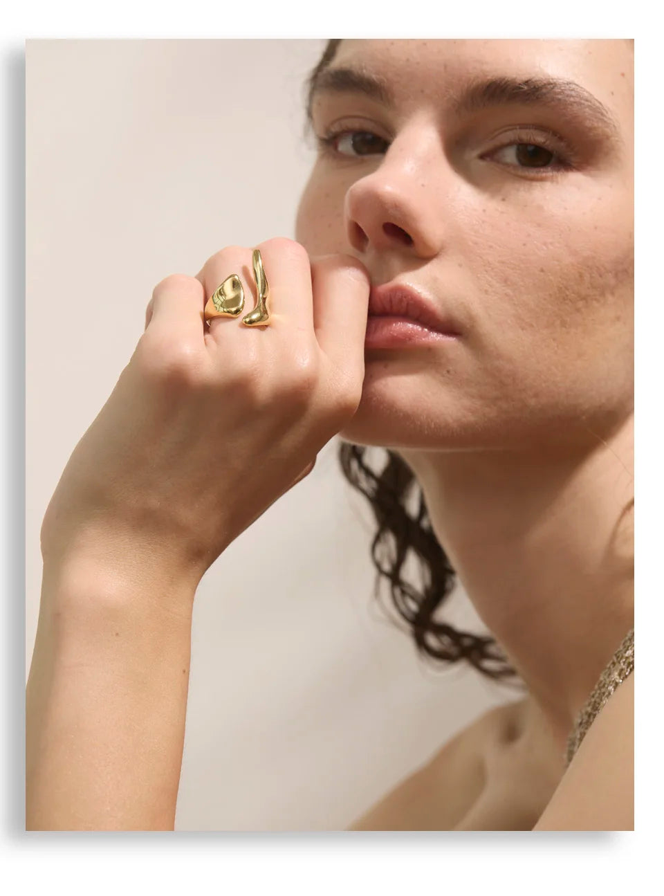 Geometric ring in 18K gold-plated stainless steel.