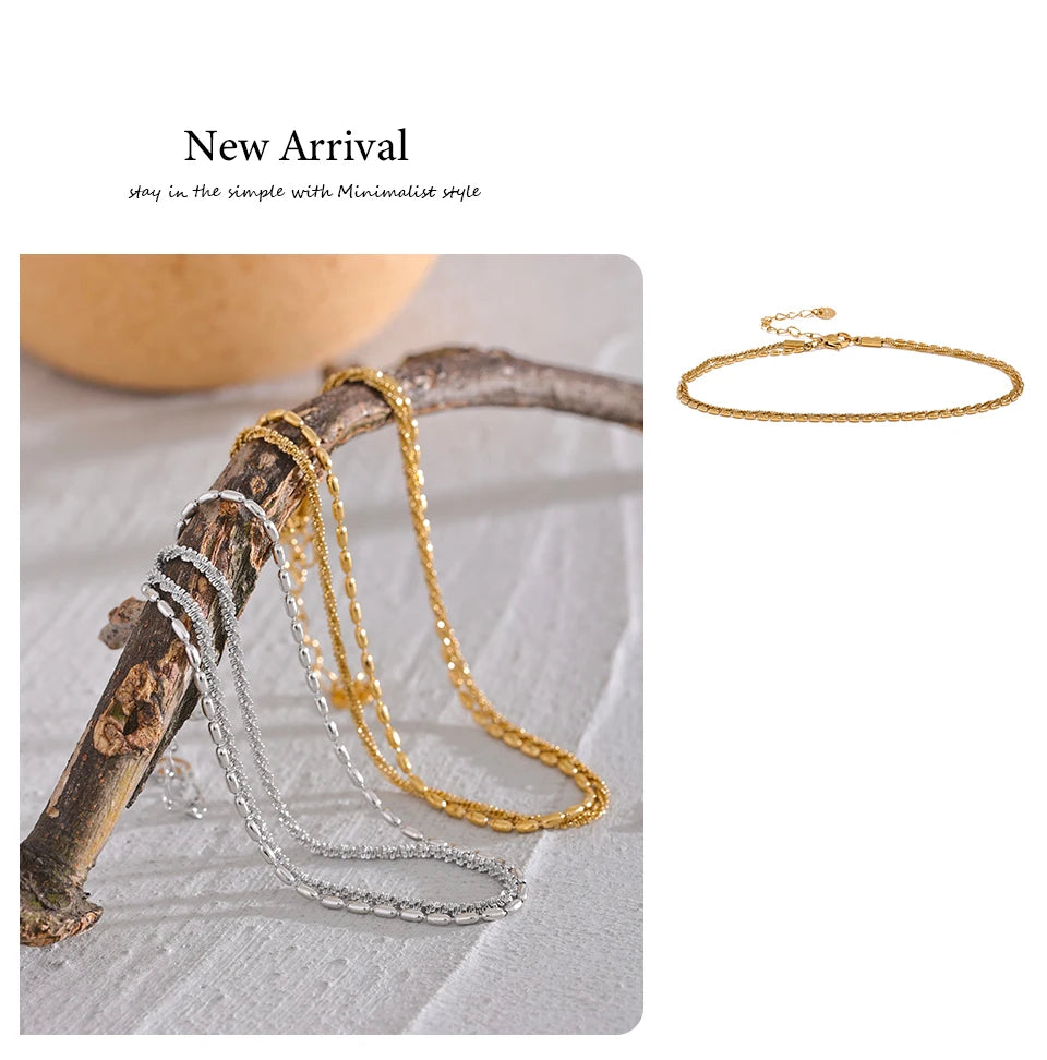 Geometric chain layered necklace in gold-plated stainless steel.
